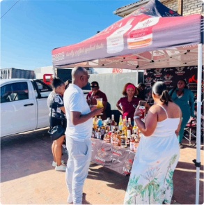 Ekhaya market stall under a branded tent